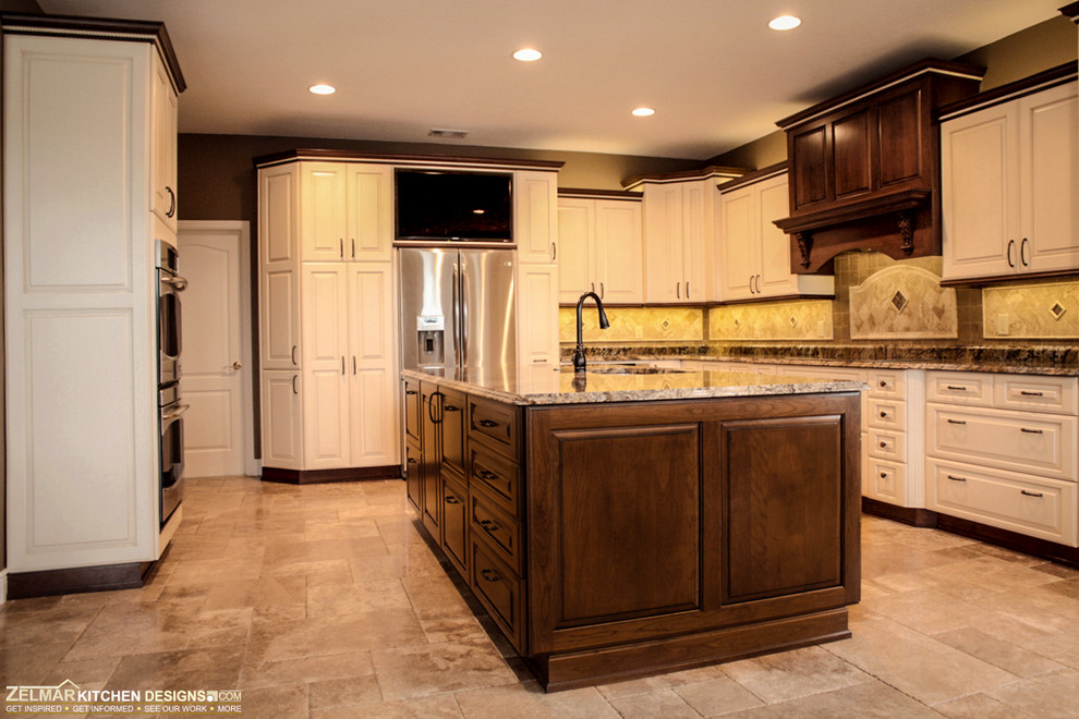 Expansive traditional eat-in kitchen in Orlando with an undermount sink, raised-panel cabinets, white cabinets, granite benchtops, beige splashback, stone tile splashback, travertine floors and with island.