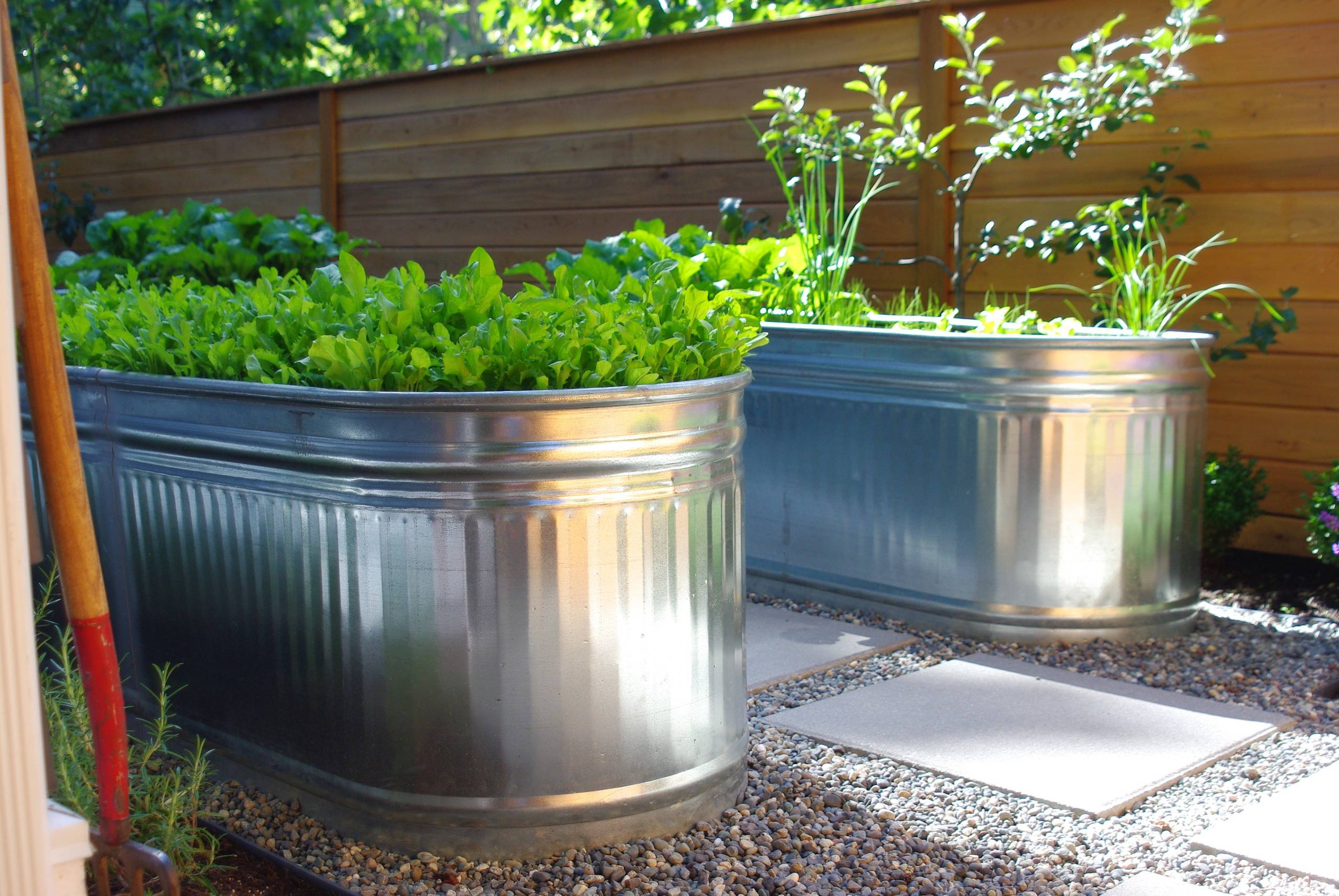 How to Turn a Stock Tank Into a Planter for Edibles and More