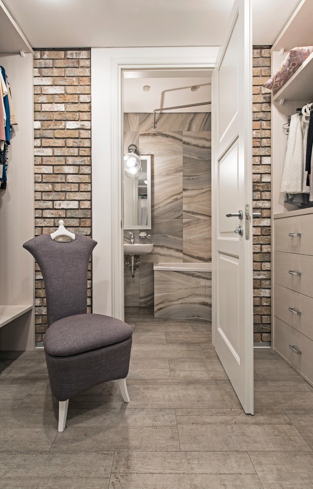 Photo of a mid-sized contemporary women's walk-in wardrobe in Moscow with open cabinets, white cabinets and porcelain floors.