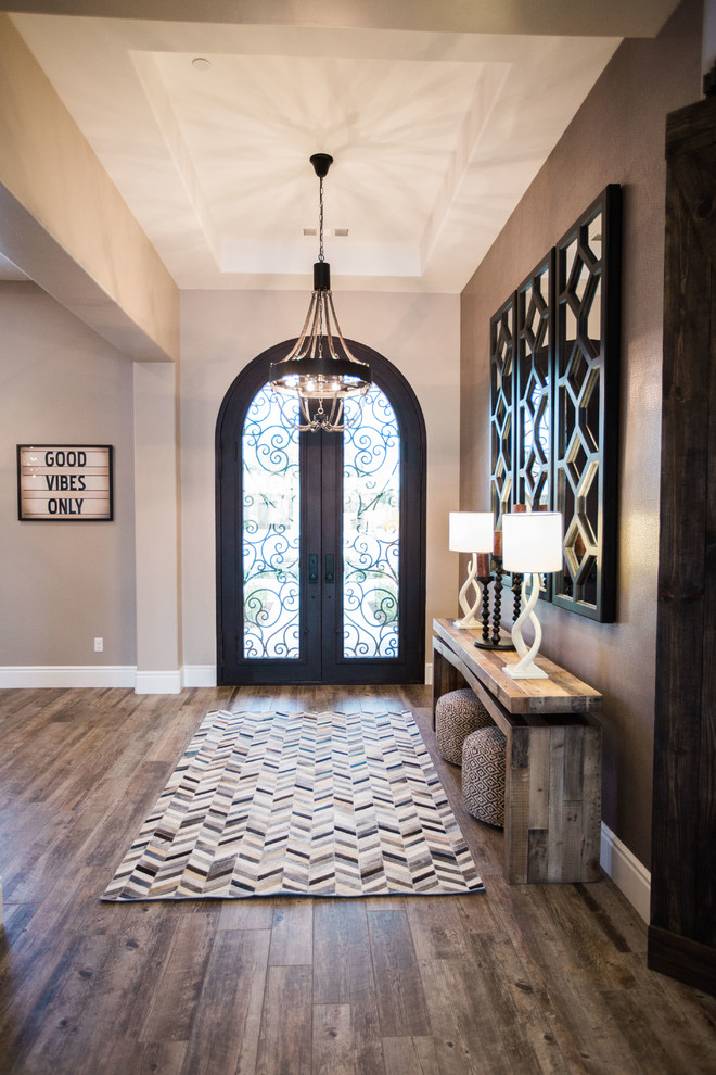 Design ideas for a transitional entryway in Other.