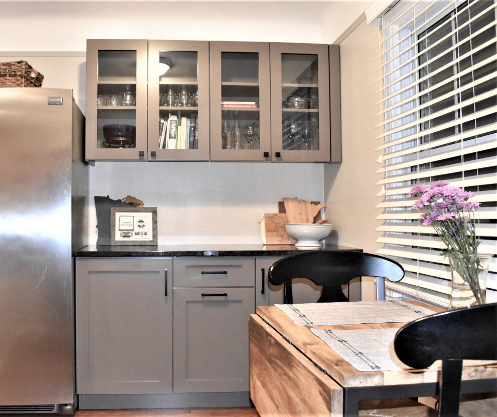 Photo of a small transitional galley eat-in kitchen in Detroit with shaker cabinets, grey cabinets, granite benchtops, no island and brown benchtop.