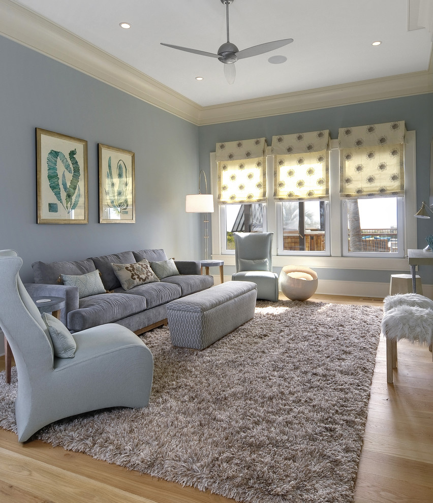 Inspiration for a contemporary family room in Charleston with blue walls.
