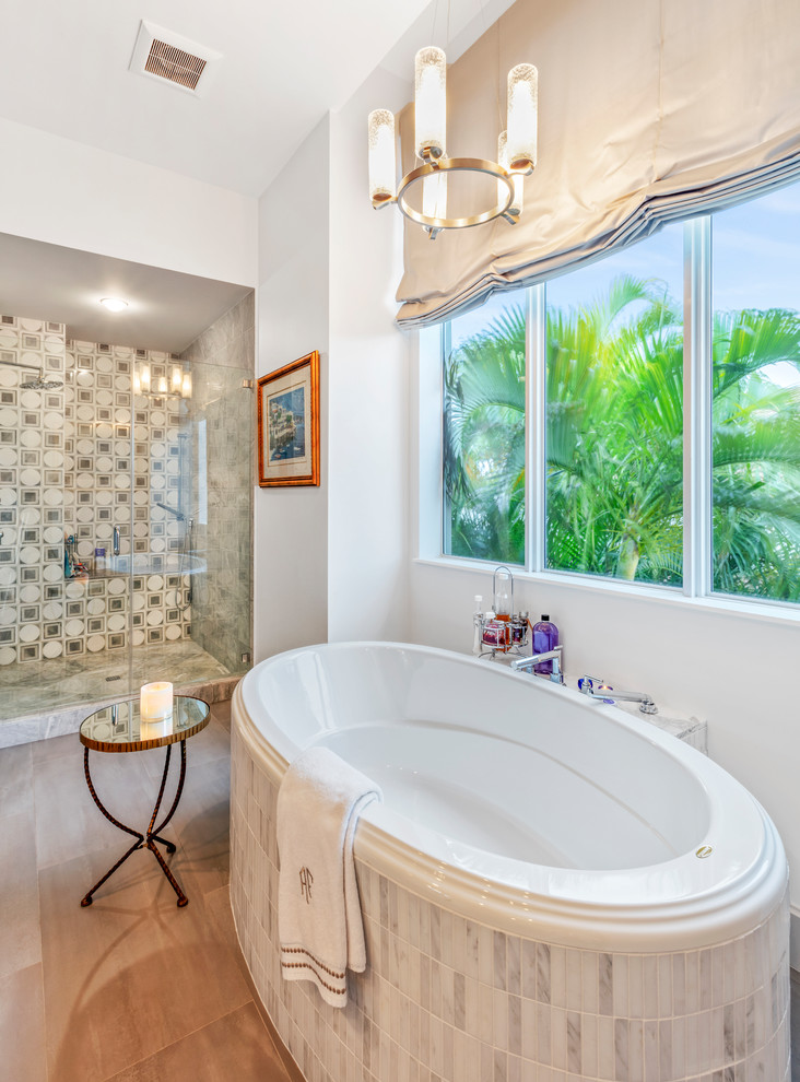 Photo of a mid-sized transitional master wet room bathroom in Miami with flat-panel cabinets, white cabinets, a drop-in tub, a one-piece toilet, multi-coloured tile, mosaic tile, white walls, light hardwood floors, an undermount sink, granite benchtops, a hinged shower door and brown benchtops.