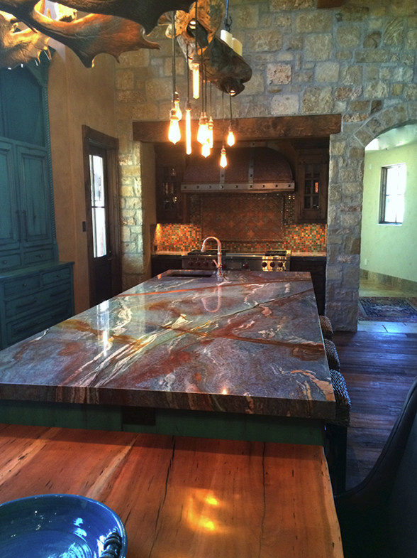 Eat-in kitchen - large rustic eat-in kitchen idea in Austin with an undermount sink, granite countertops and an island