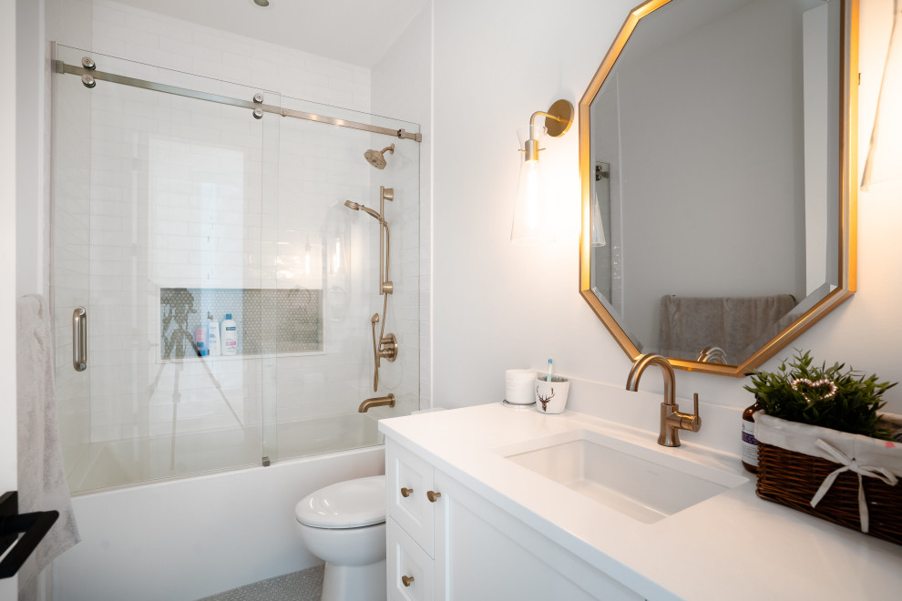 Farmhouse 3/4 white tile and porcelain tile porcelain tile, gray floor and single-sink alcove bathtub photo in Vancouver with shaker cabinets, white cabinets, white walls, an undermount sink, quartz countertops, white countertops and a built-in vanity
