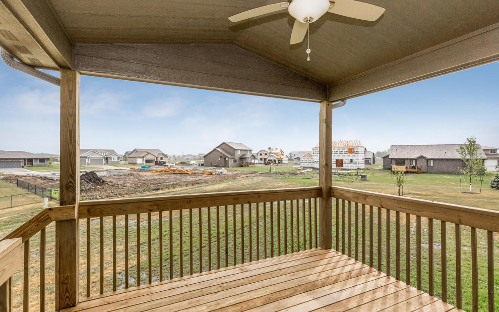 Deck - mid-sized craftsman backyard deck idea with a roof extension