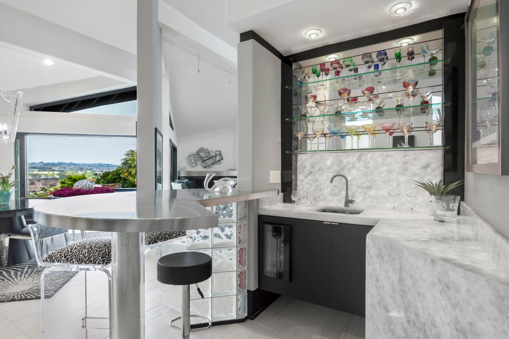 Mid-sized contemporary home bar in Orange County with an undermount sink, flat-panel cabinets, black cabinets, quartzite benchtops, white splashback, porcelain floors, white floor and white benchtop.