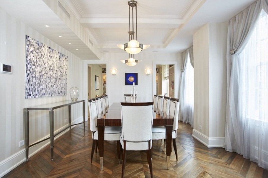 Inspiration for a traditional separate dining room in New York with white walls and medium hardwood floors.