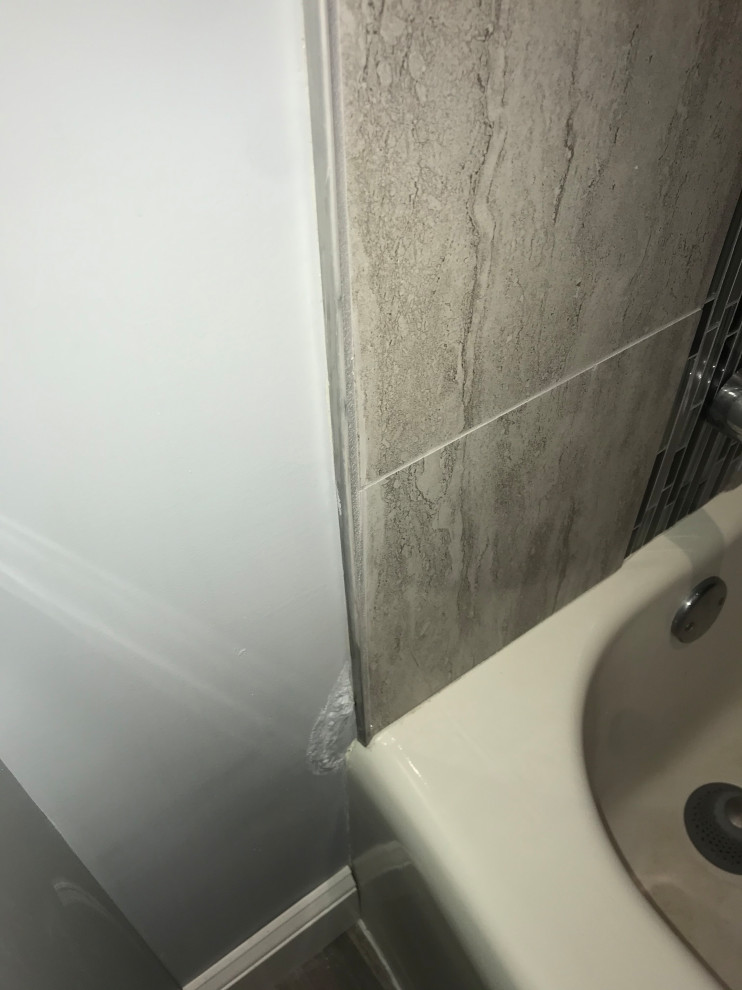 Paint bubbling at edge of shower