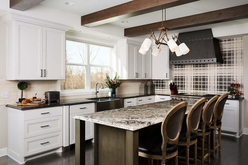 Inspiration for a country l-shaped kitchen in Minneapolis with a farmhouse sink, beaded inset cabinets, white cabinets, granite benchtops, beige splashback, stainless steel appliances, dark hardwood floors, with island and brown floor.