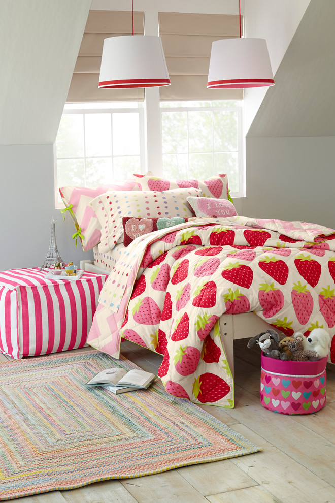 Inspiration for a contemporary kids' bedroom for girls in Boston with white walls and light hardwood floors.