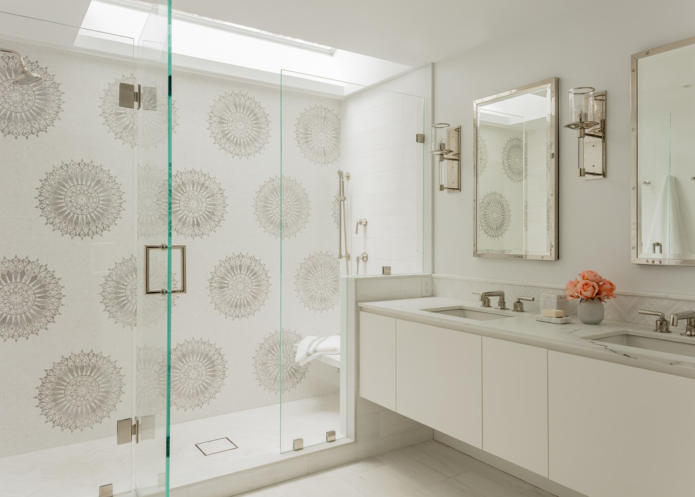 Design ideas for a contemporary master bathroom in Boston with flat-panel cabinets, white cabinets, marble floors, an undermount sink, marble benchtops, white benchtops, an alcove shower, multi-coloured tile, white walls and a hinged shower door.