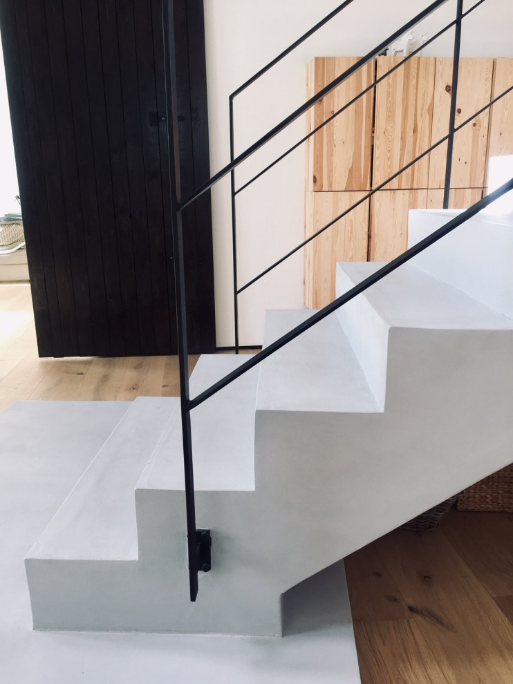 This is an example of a large scandinavian staircase in Melbourne with wallpaper.