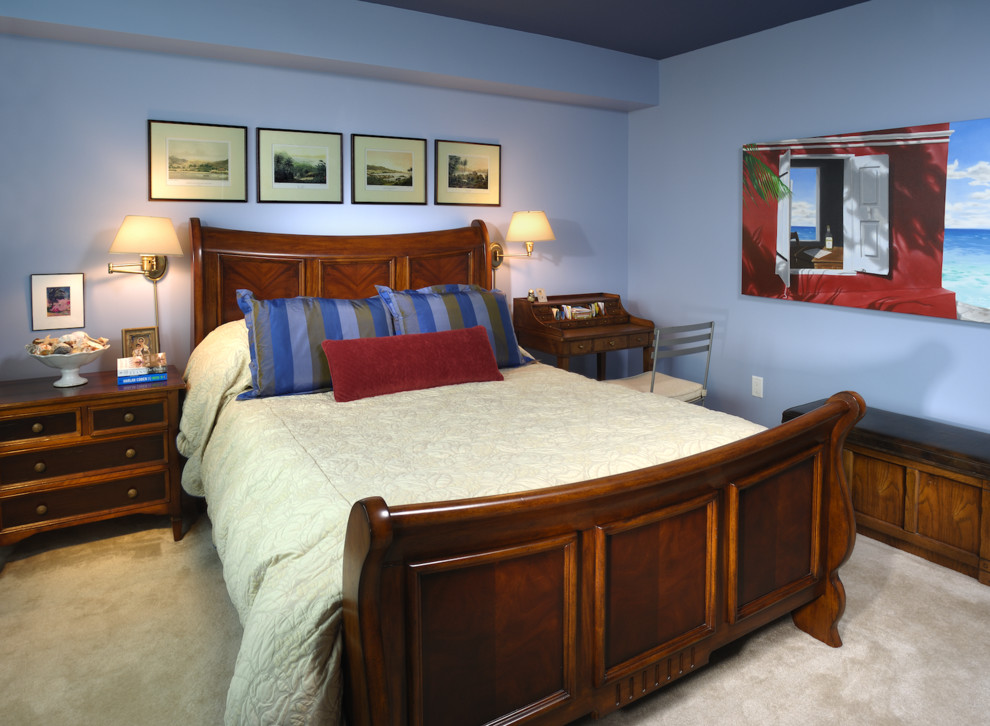 Mid-sized traditional master bedroom in Miami with blue walls and carpet.