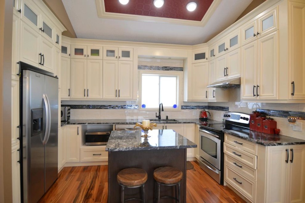 Example of a transitional kitchen design in Calgary