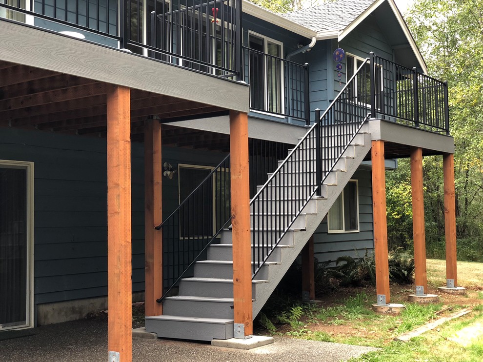 Inspiration for a large transitional backyard deck remodel in Seattle with no cover