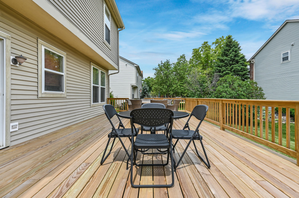 Deck - backyard wood railing deck idea in Chicago