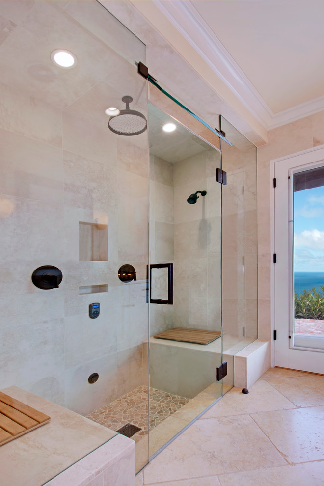 Design ideas for a small arts and crafts bathroom in Los Angeles with an undermount sink, shaker cabinets, white cabinets, limestone benchtops, a wall-mount toilet, beige tile, stone tile, white walls, limestone floors, with a sauna, an alcove shower, beige floor and a hinged shower door.