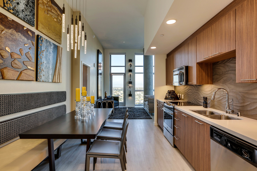 Example of a small trendy single-wall porcelain tile open concept kitchen design in Los Angeles with an undermount sink, flat-panel cabinets, medium tone wood cabinets, quartz countertops, porcelain backsplash, stainless steel appliances, no island and brown backsplash