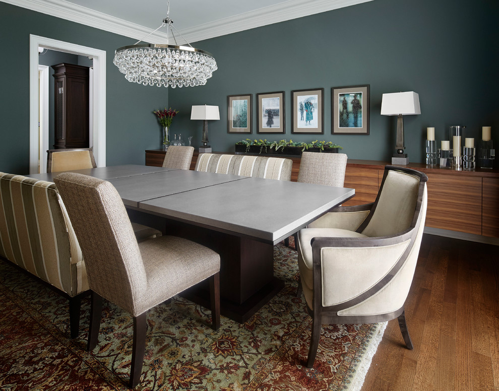 Transitional separate dining room in Chicago with blue walls and medium hardwood floors.