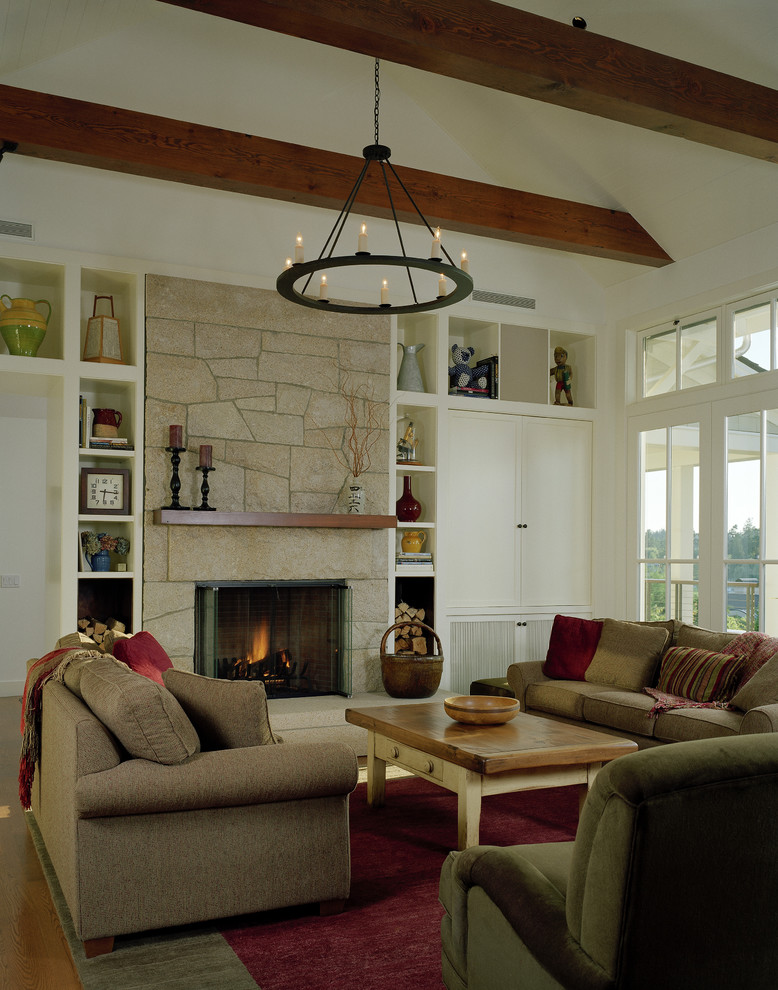 Inspiration for a country living room in Seattle with a stone fireplace surround.