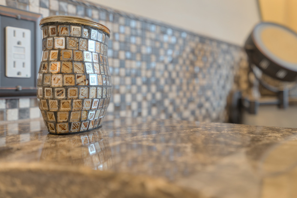 Inspiration for a mid-sized transitional master multicolored tile ceramic tile home design remodel with raised-panel cabinets, beige cabinets, a two-piece toilet, beige walls, an undermount sink and quartz countertops