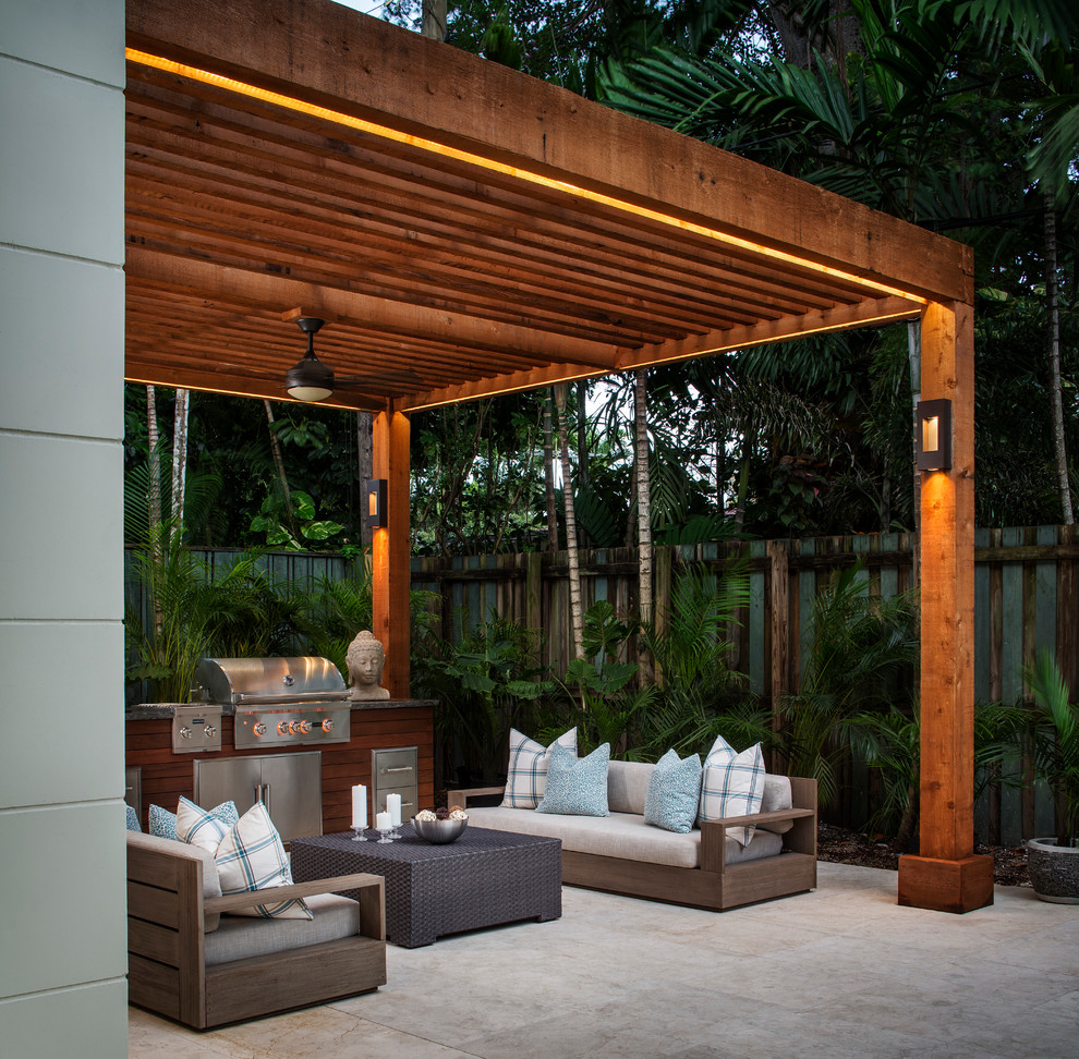 Design ideas for a mid-sized tropical patio in Miami.