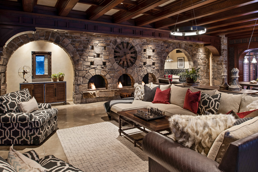 This is an example of a traditional family room in Minneapolis with a standard fireplace and a stone fireplace surround.