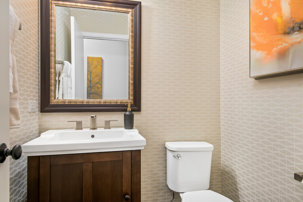 Mid-sized transitional powder room photo in Chicago with shaker cabinets, dark wood cabinets, a two-piece toilet, multicolored walls and a drop-in sink
