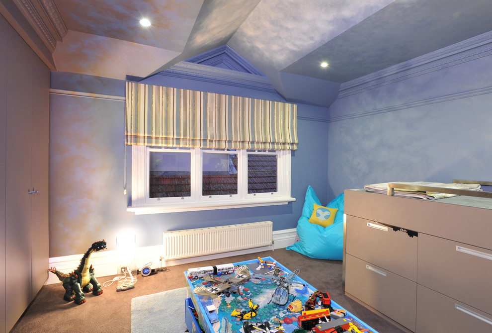 Design ideas for a contemporary kids' bedroom for kids 4-10 years old and boys in Melbourne with blue walls and carpet.