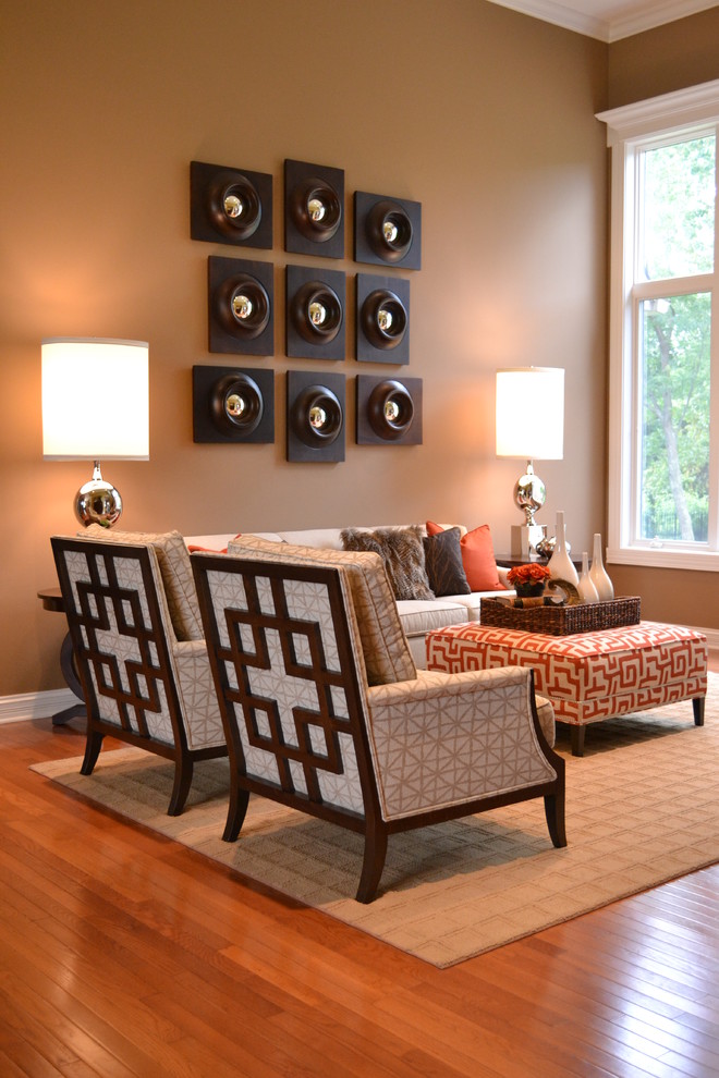 This is an example of a transitional living room in Other with brown walls.