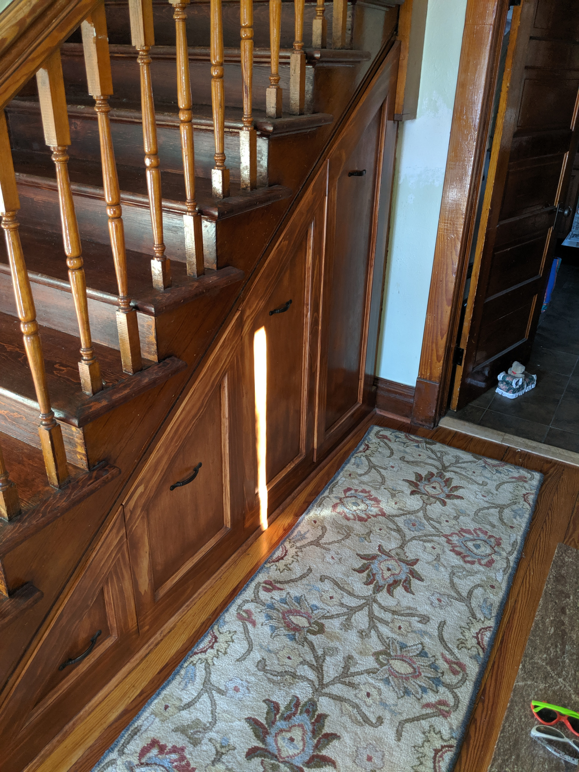 Entry hall closet built under stairs
