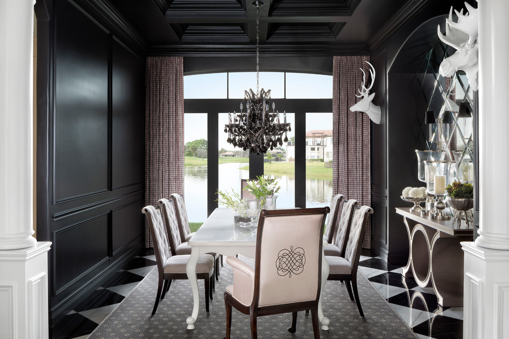 This is an example of a traditional dining room in Miami with black walls, marble floors, multi-coloured floor and no fireplace.