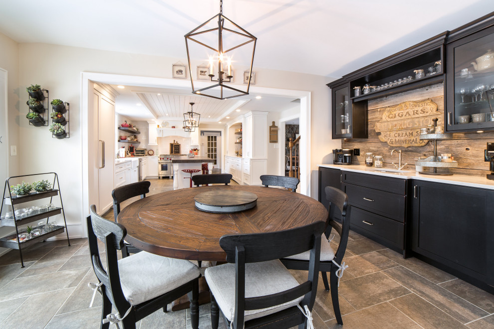Large country l-shaped eat-in kitchen in New York with a farmhouse sink, recessed-panel cabinets, white cabinets, concrete benchtops, white splashback, ceramic splashback, stainless steel appliances, porcelain floors, grey floor, grey benchtop and coffered.