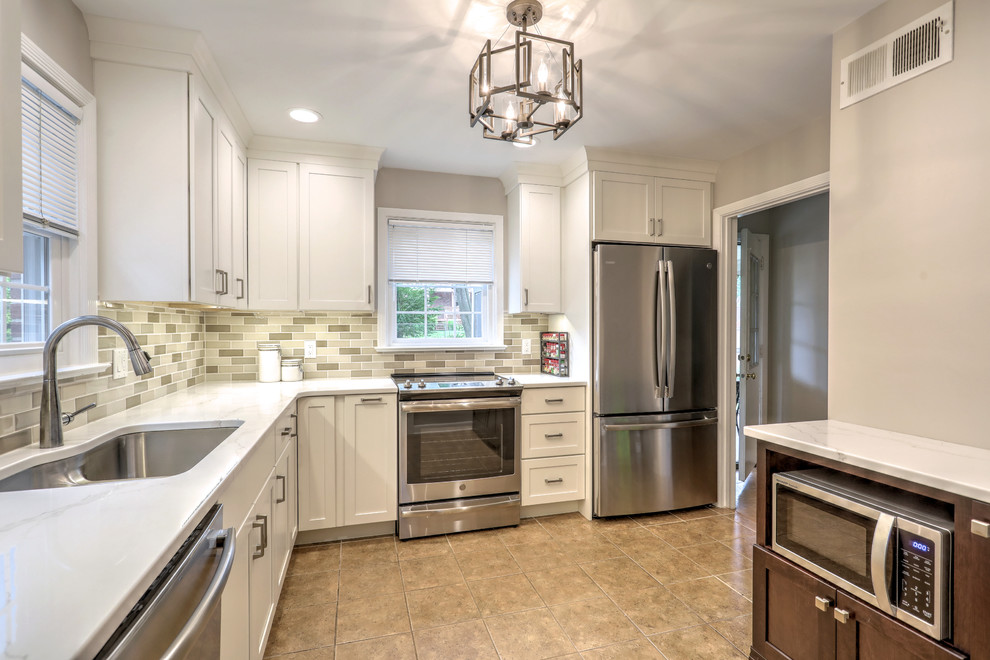 Inspiration for a small transitional ceramic tile and beige floor kitchen remodel with a double-bowl sink, shaker cabinets, quartz countertops, beige backsplash, ceramic backsplash, stainless steel appliances and white countertops