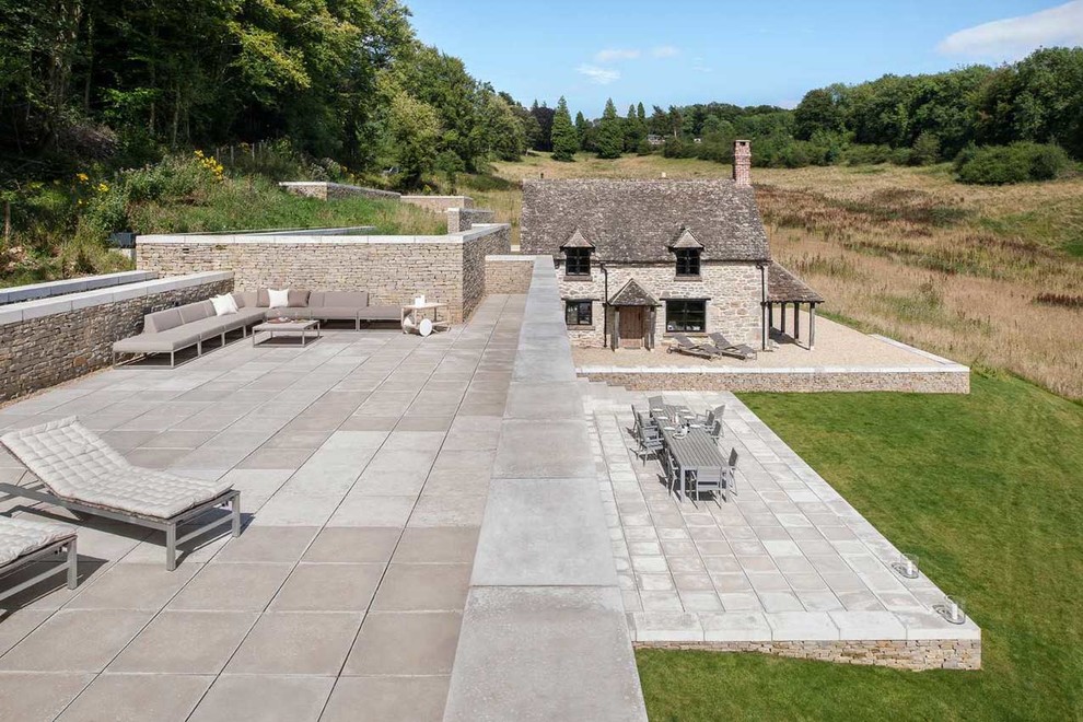 Design ideas for a modern exterior in Gloucestershire with stone veneer.