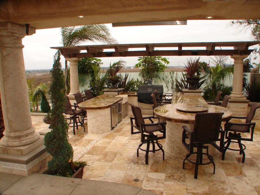 This is an example of a tropical patio in Orange County.