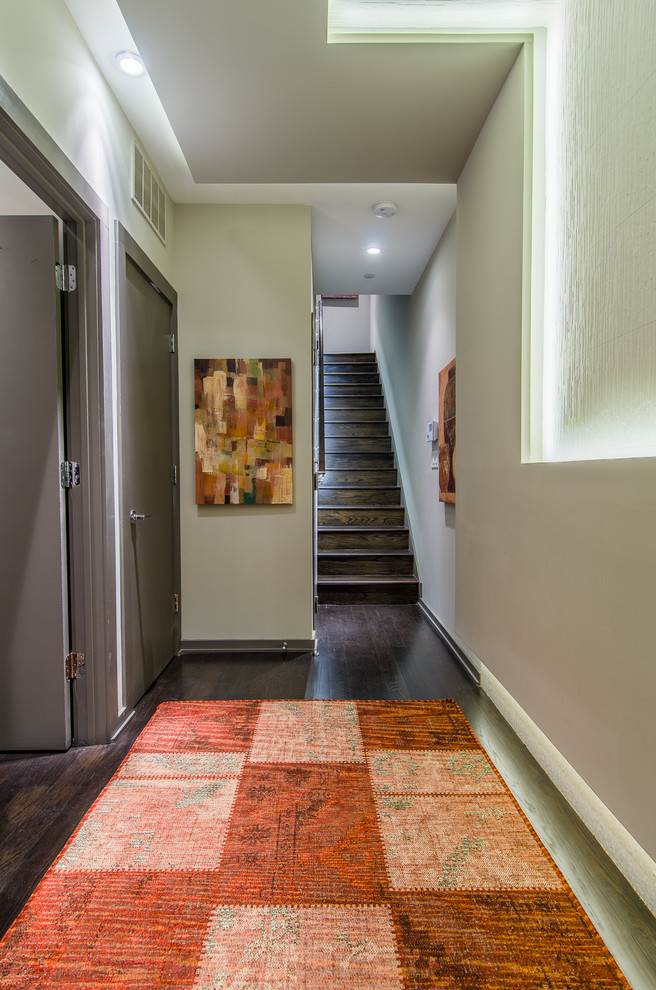 Photo of a contemporary foyer in Baltimore with dark hardwood floors and grey walls.