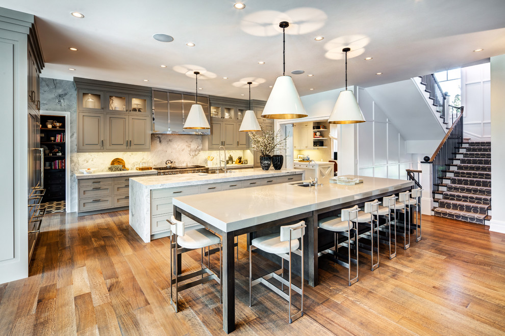 Expansive arts and crafts eat-in kitchen in Salt Lake City with flat-panel cabinets, white cabinets and multiple islands.