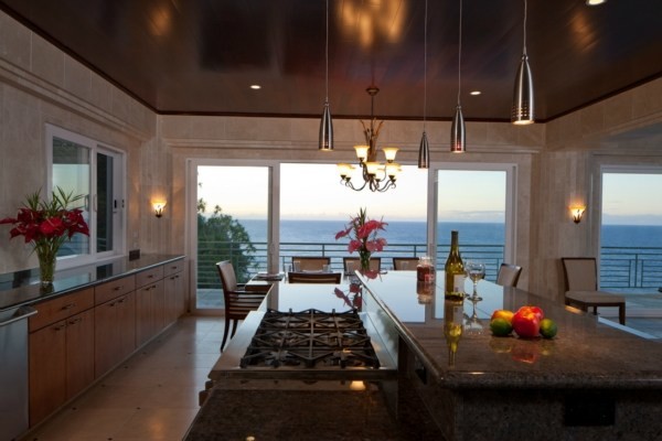 Expansive contemporary l-shaped kitchen in Hawaii with open cabinets, beige cabinets, quartz benchtops, black splashback, cement tile splashback, cement tiles and with island.
