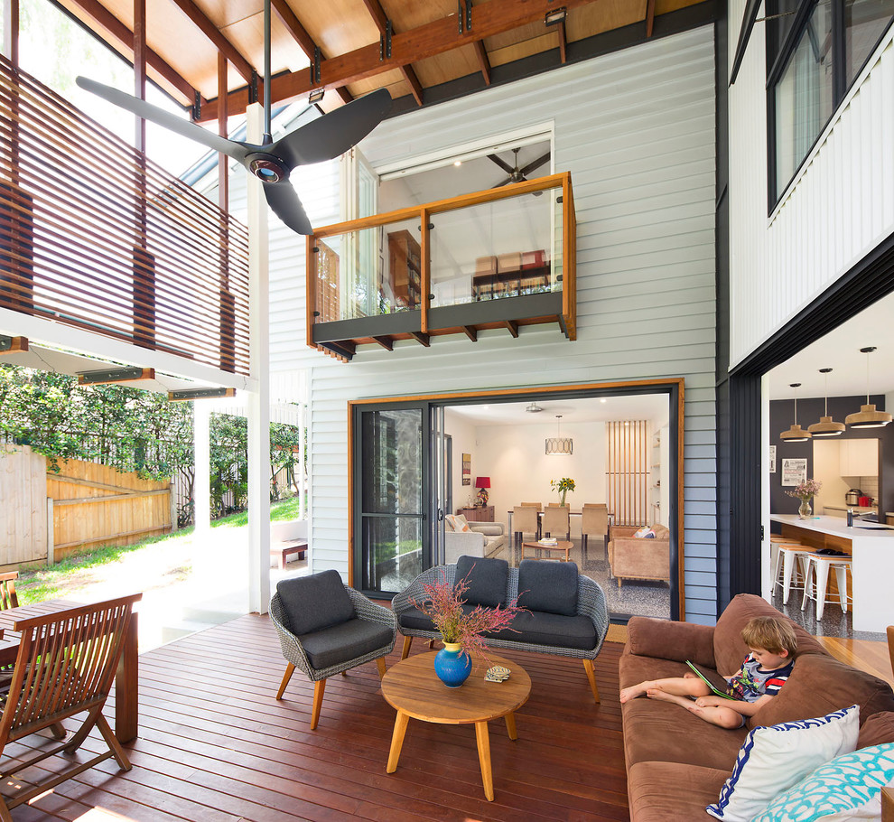 Inspiration for a contemporary backyard deck in Brisbane with a roof extension.