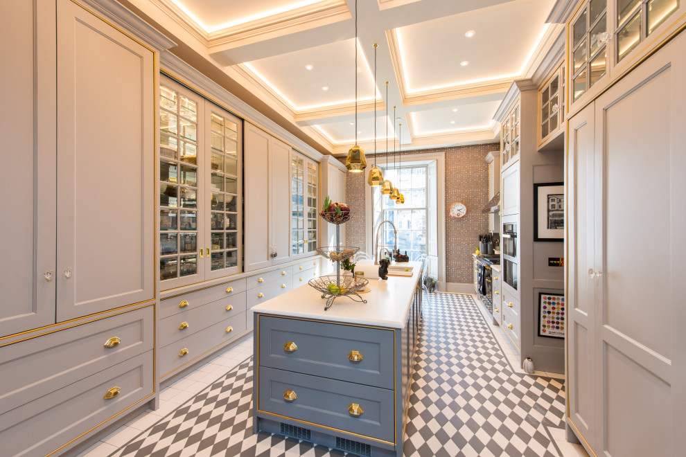 Inspiration for a traditional galley separate kitchen in Other with an undermount sink, recessed-panel cabinets, grey cabinets, stainless steel appliances, with island, multi-coloured floor and white benchtop.