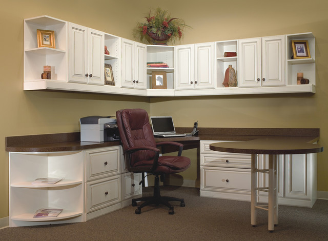Home Office With Extended Round Table And Lots Of Storage And Wall