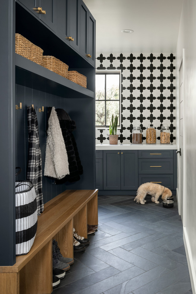 Example of a small cottage l-shaped slate floor and gray floor utility room design in Denver with an undermount sink, flat-panel cabinets, blue cabinets, quartzite countertops, black backsplash, cement tile backsplash, gray walls, a side-by-side washer/dryer and white countertops