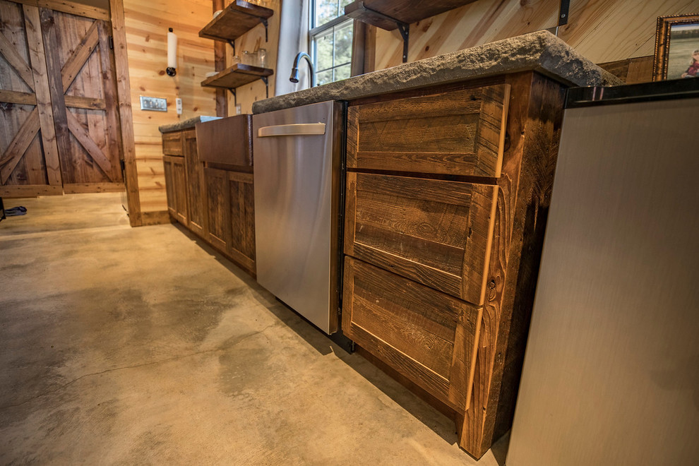Inspiration for a small country u-shaped eat-in kitchen in Wichita with a farmhouse sink, shaker cabinets, distressed cabinets, concrete benchtops, brown splashback, timber splashback, stainless steel appliances, concrete floors, with island and grey floor.
