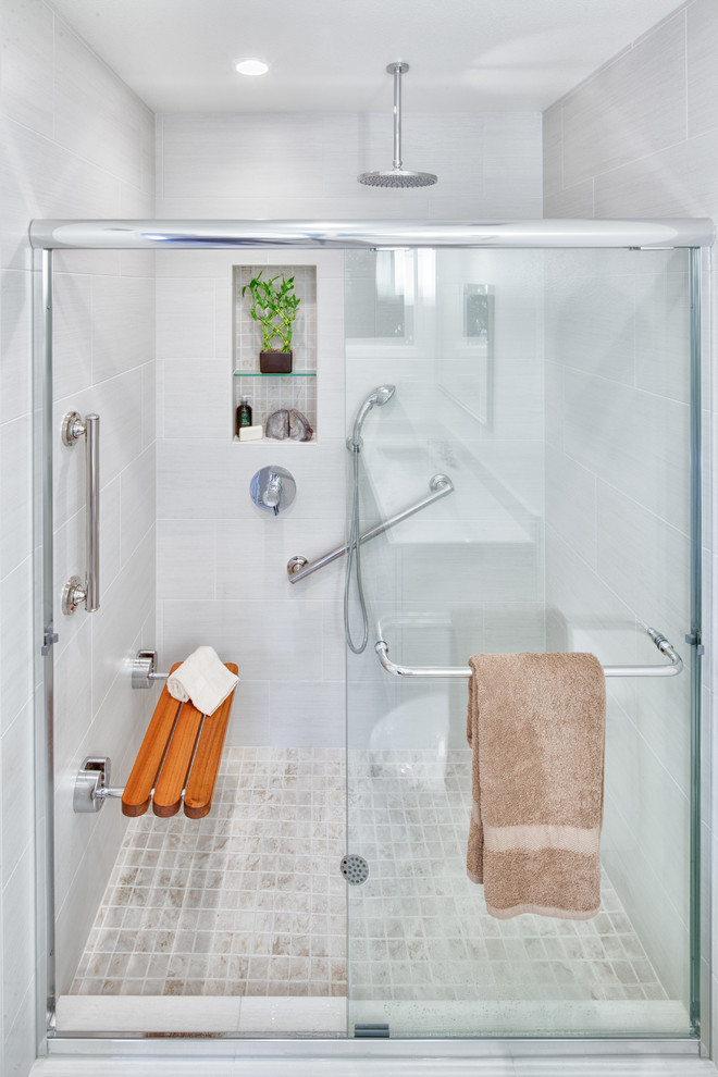 This is an example of a small transitional 3/4 bathroom in San Diego with recessed-panel cabinets, white cabinets, an alcove shower, white tile, ceramic tile, white walls, ceramic floors, an undermount sink and tile benchtops.
