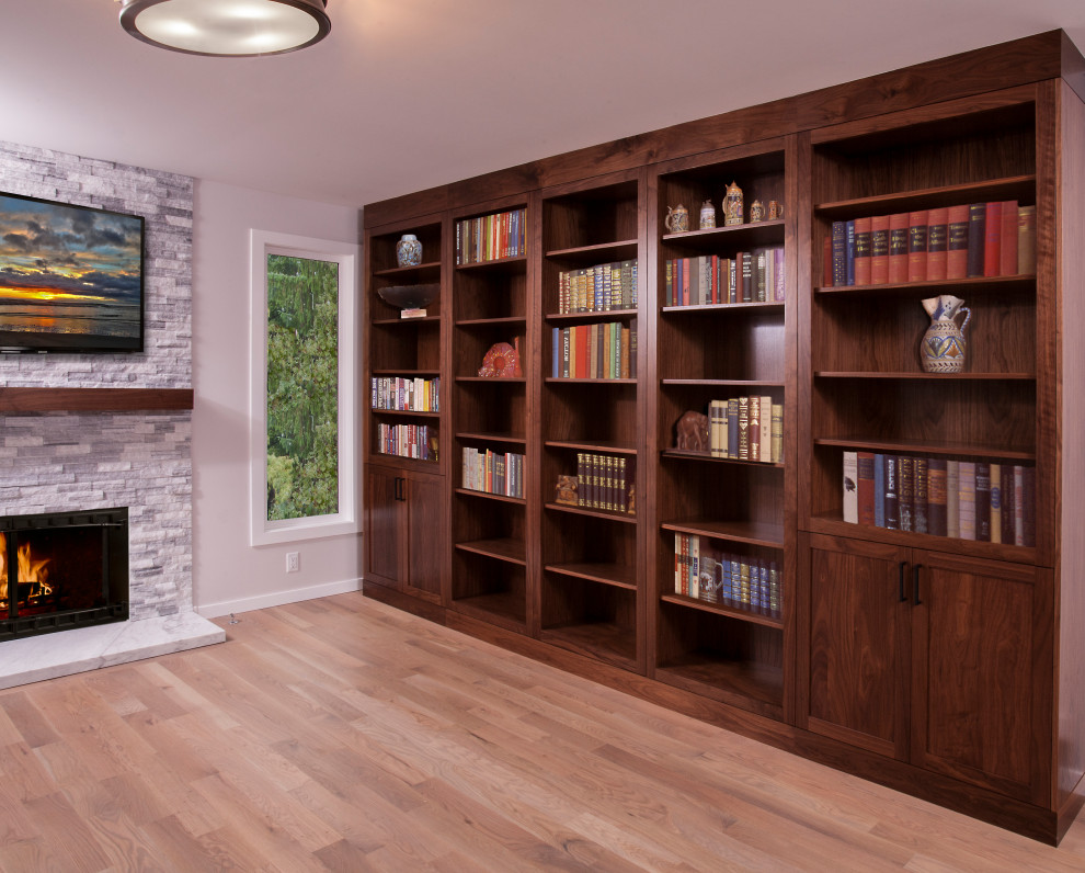 Eat-in kitchen - large transitional u-shaped light wood floor and brown floor eat-in kitchen idea in Seattle with a farmhouse sink, dark wood cabinets, white backsplash, subway tile backsplash, stainless steel appliances, an island and white countertops