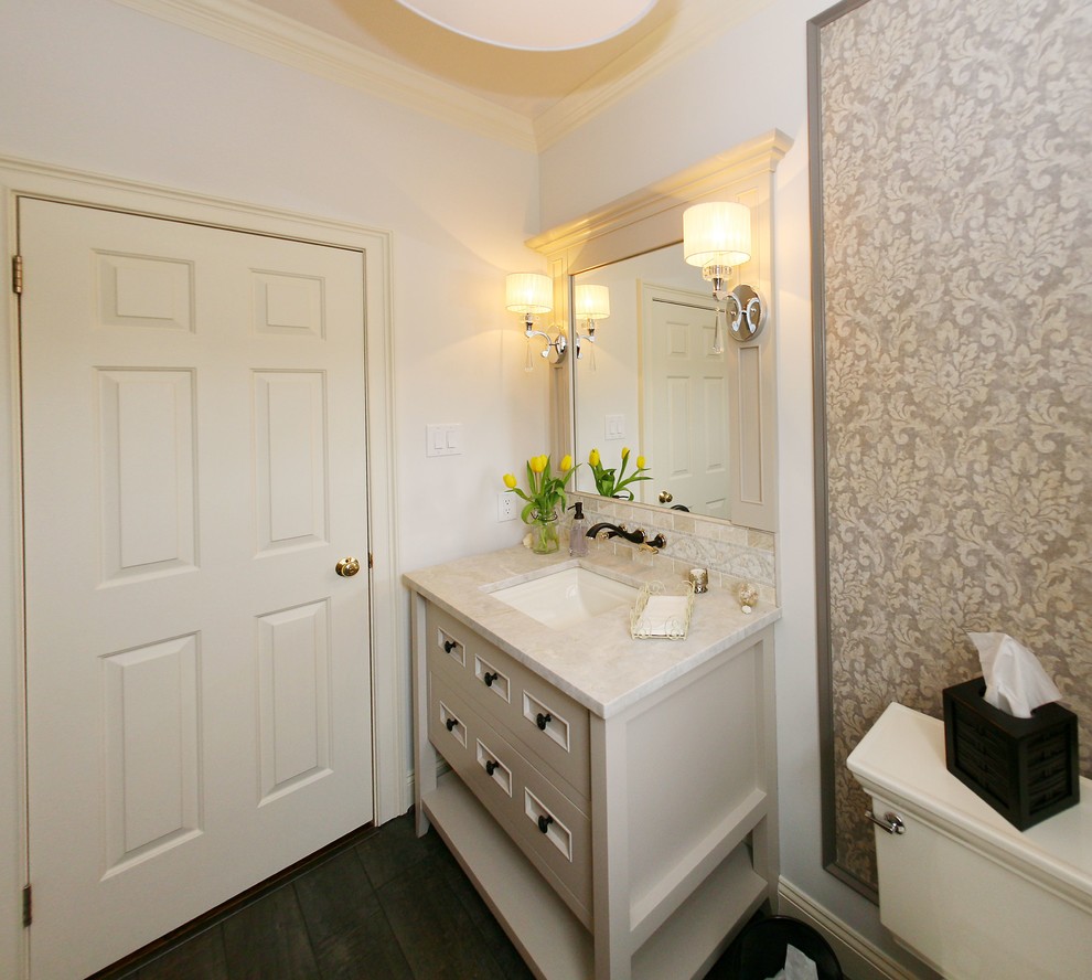 Photo of a mid-sized transitional 3/4 bathroom in Philadelphia with furniture-like cabinets, white cabinets, a two-piece toilet, beige walls, plywood floors, an undermount sink and marble benchtops.