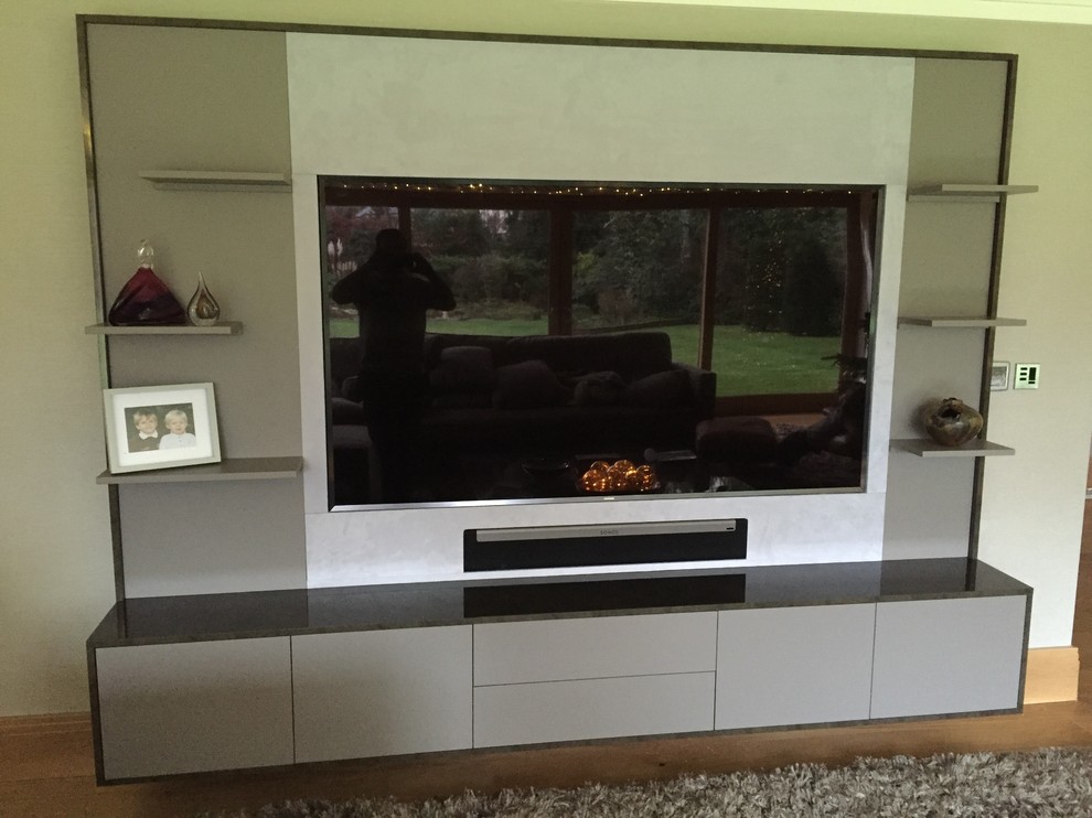 Design ideas for a medium sized contemporary living room in Surrey with a built-in media unit.