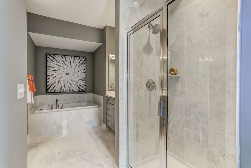 Inspiration for a large transitional master bathroom in DC Metro with raised-panel cabinets, grey cabinets, a drop-in tub, an alcove shower, grey walls, marble floors, an undermount sink, marble benchtops, white floor, a hinged shower door, white tile and marble.